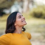 close-up-image-young-woman-relaxing-park-springtime-scaled-1.jpg